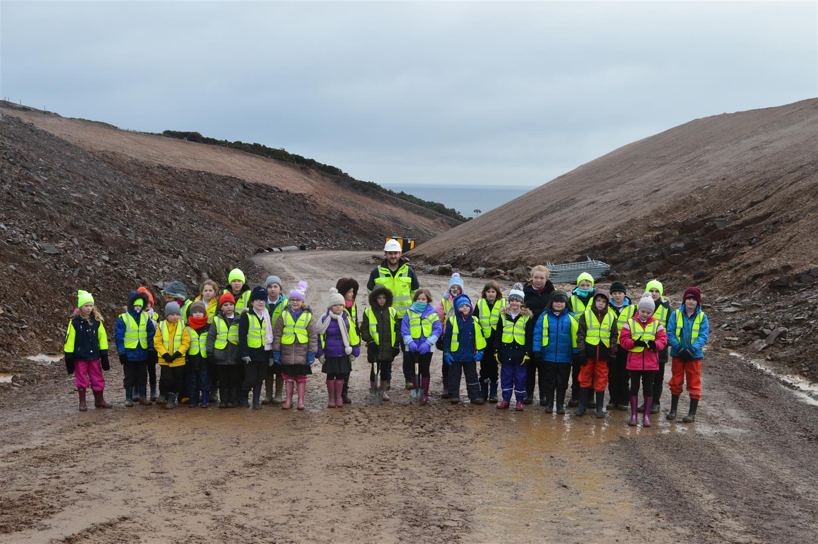 Schoolchildren standing at the A9 Berriedale Project