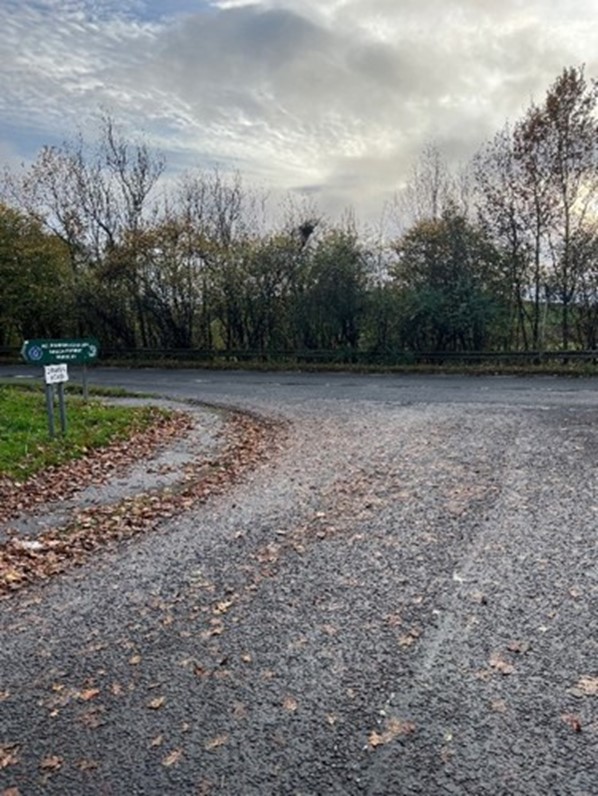 The before image showing a left turn in the road with no road safety interventions.