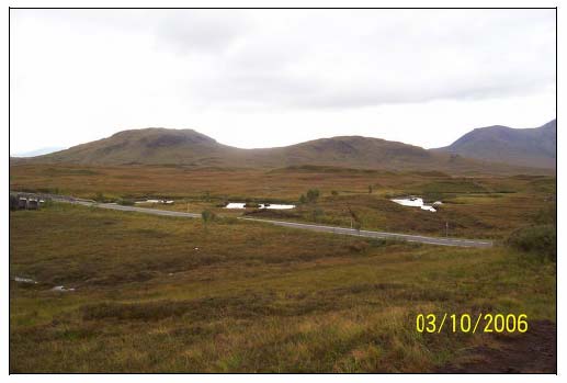 Figure 6.3 Hummocky moraine or drumlin immediately adjacent to the road on the north side of the river. The cutting is immediately adjacent to the road (centre of picture).