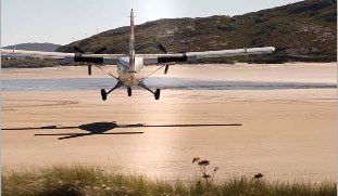 Twin Otter aircraft landing on Traigh Mhor beach at Barra