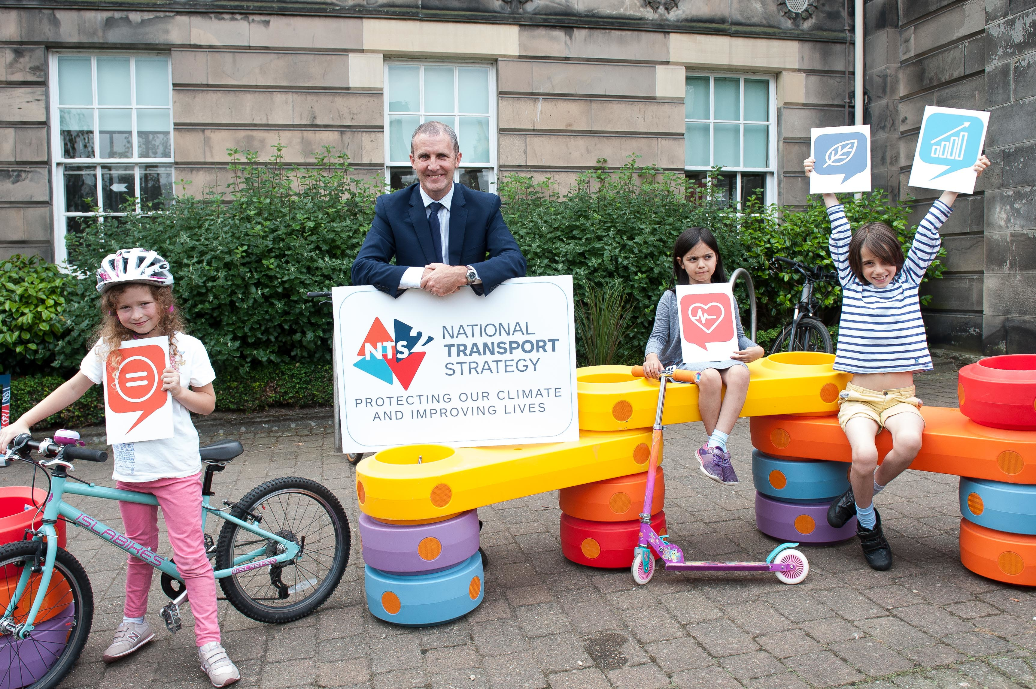 Michael Matheson with children at National Transport Strategy launch