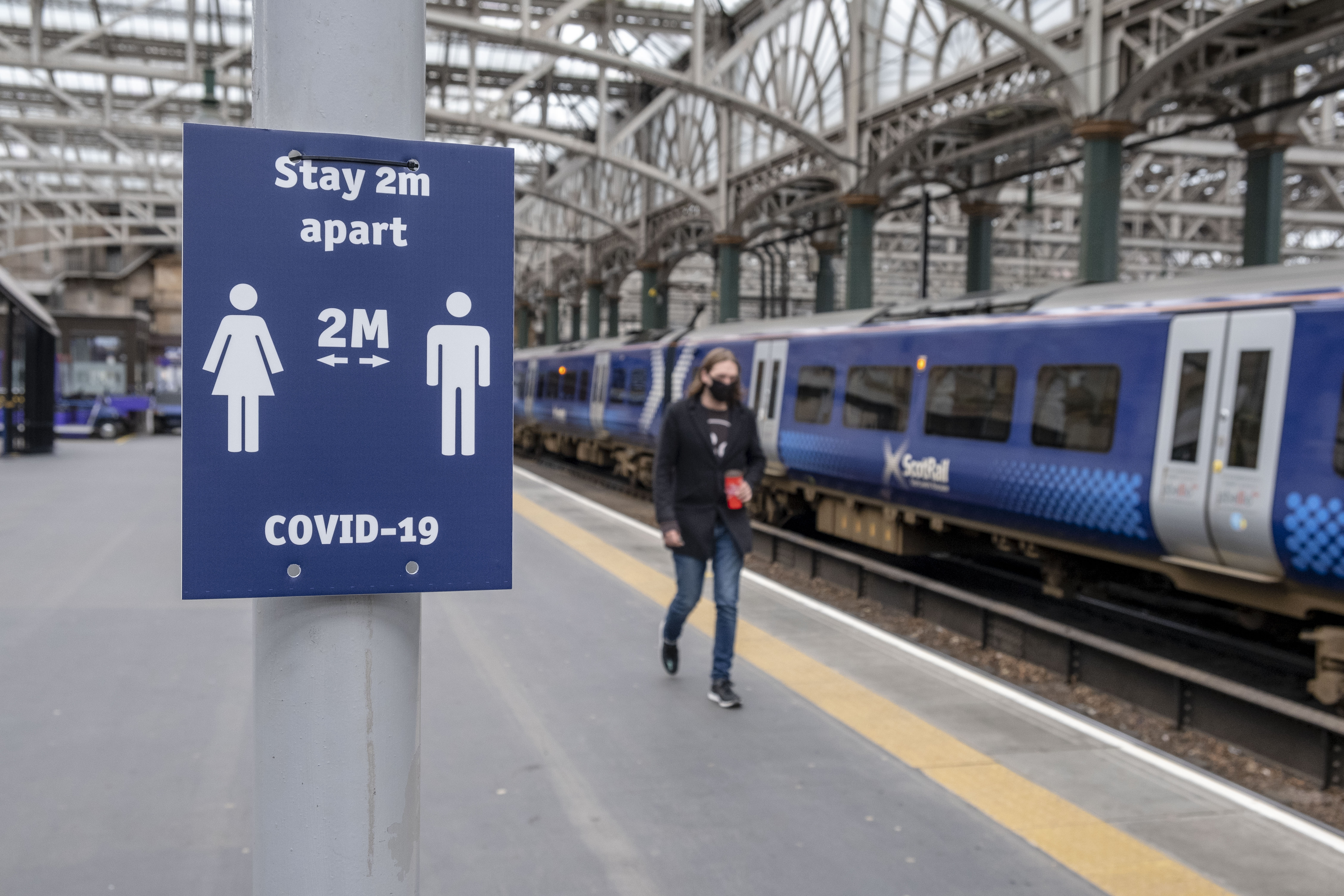 Physical distancing sign at Glasgow Central station