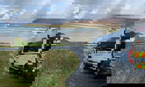An ambulance visiting a remote community in the west of Scotland.