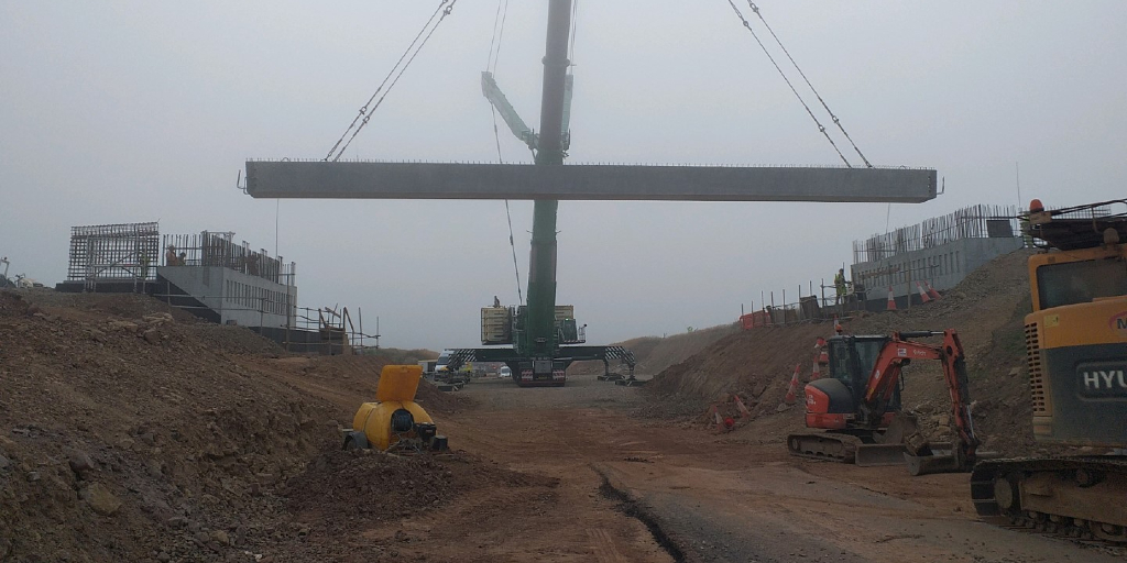 Beam being lifted by large crane at the works for the A77 Maybole Bypass