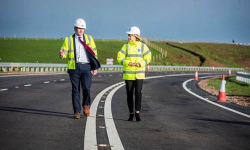 Transport Minister Jenny Gilruth walking with site staff at the new A77 Maybole Bypass