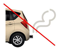 The exhaust pipe at the back of a car, with fumes coming out. A diagonal red line crosses the image out.