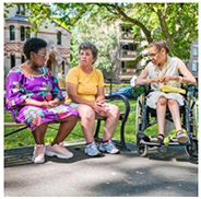 3 women chatting in a park.