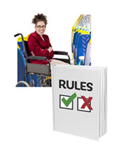 A woman in a wheelchair travelling by train. A rule book.