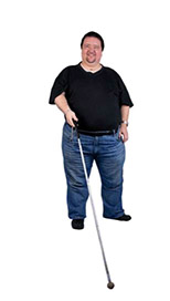 A man with sight loss, using a long white cane.
