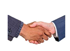 2 people shaking hands.