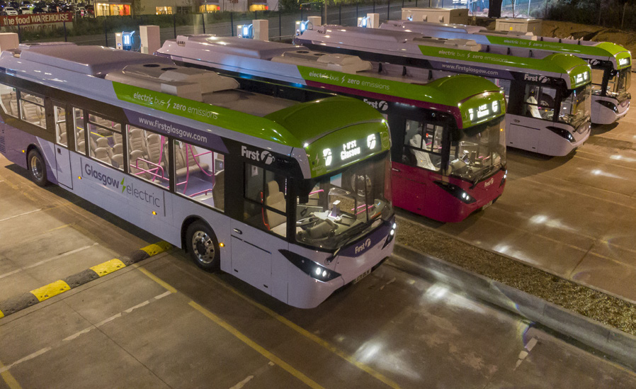 An aerial view of 4 electric First buses in Glasgow.