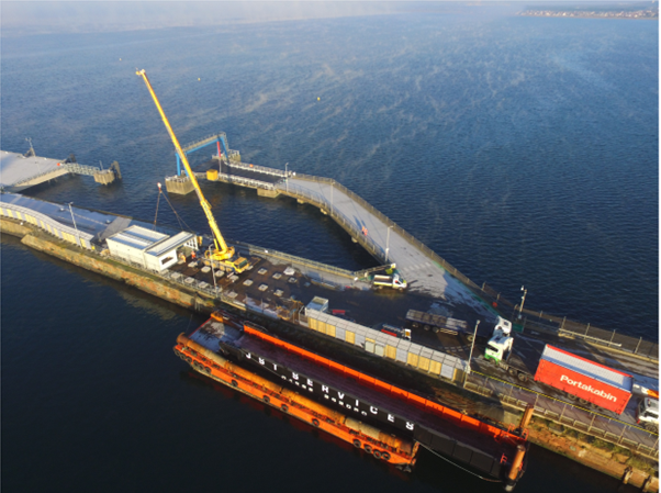 Aerial photo of Troon harbour terminal under construction with containers being unloaded