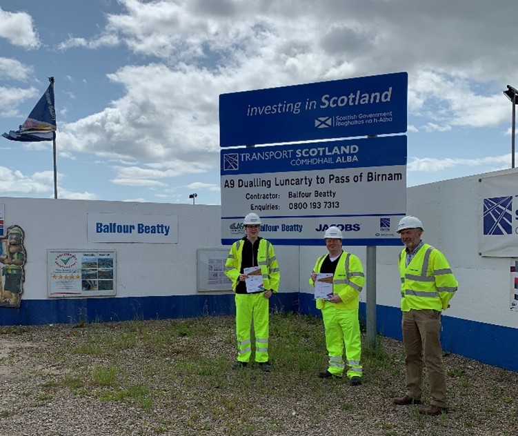 Construction Manager, Alan Thompson, presents Calum and Jamie with their certificates after a successful placement