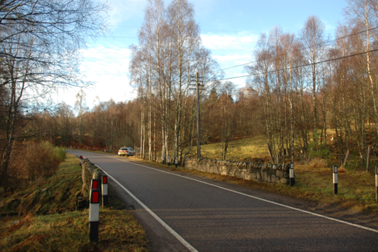 Single track road passing through countryside, and over Allt Lagain Bhain Bridge.