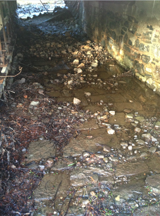 Brick laid stone under the bridge