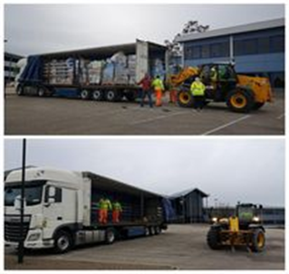 Photograph of lorries being loaded with humanitarian aid donations with the help of Balfour Beatty