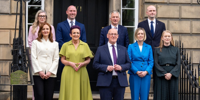 First Minister John Swinney poses for a photo with the members of his Cabinet.