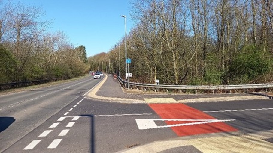 The after image showing cars travelling along the road approaching a left turn and the new active travel interventions making it safer for pedestrians to cross the road.