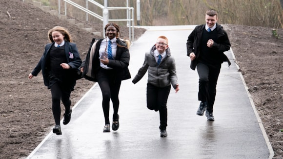 A photograph of school children using the new Renfrew Road walkway