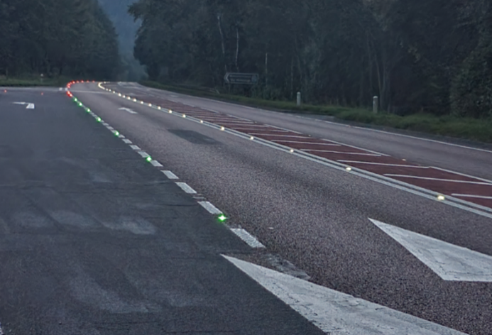 Solar studs lighting up the approach and exit at the junction on the left
