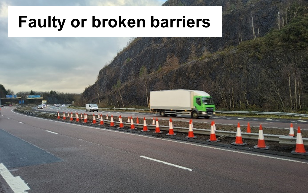 Cones surrounding a broken barrier between dual carriageway lanes