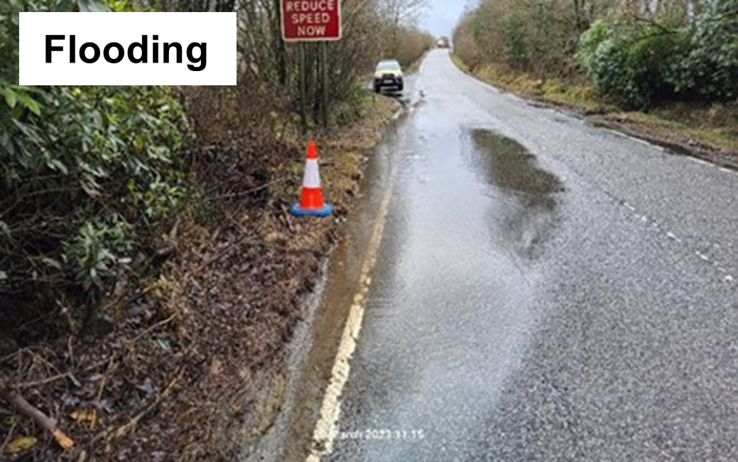 Road flooding the left lane of the road